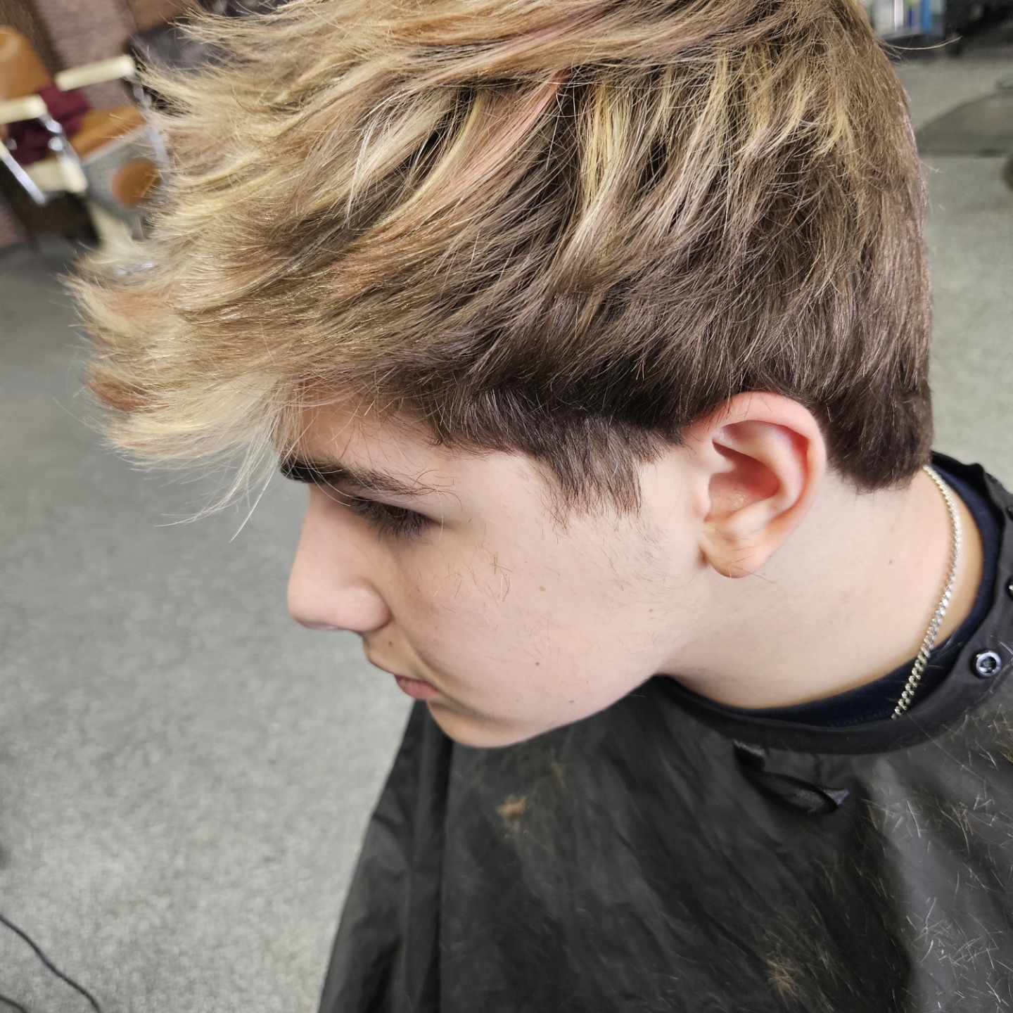 Textured haircut with highlights at Lucky's Barber Shop